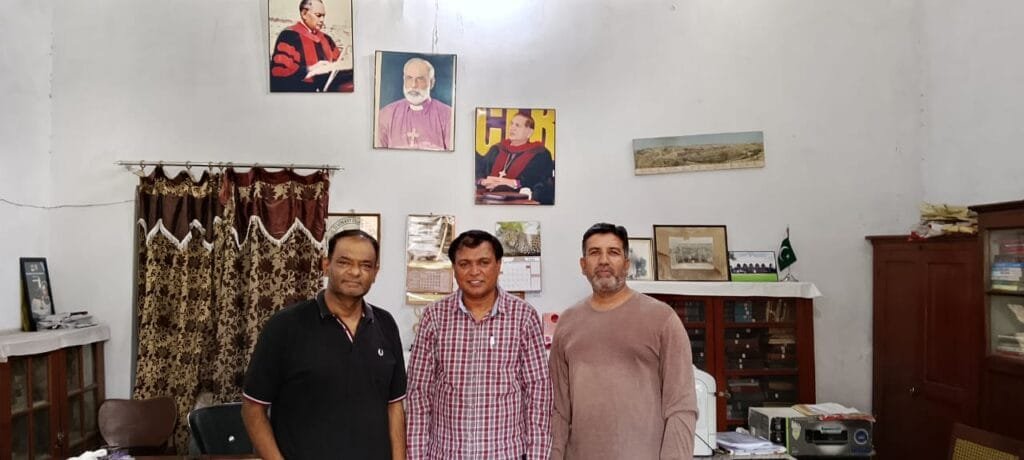 Mr. Shahzad Lawrence, Elder Kamil Nasir, and Rev. Inam N. A. Khan during a meeting.