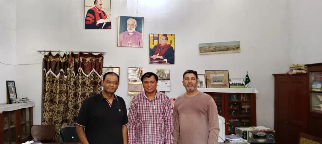 Mr. Shahzad Lawrence, Elder Kamil Nasir, and Rev. Inam N. A. Khan during a meeting.