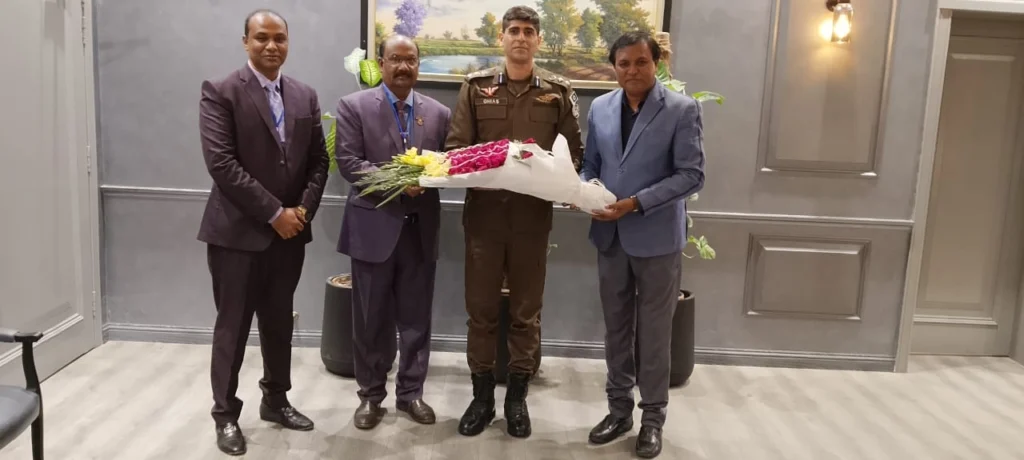 Shahzad Lawrence presenting bouquet to Sardar Ghias Gul