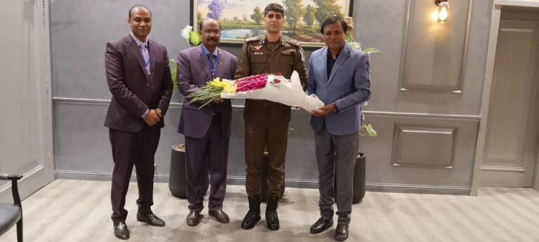 Shahzad Lawrence presenting bouquet to Sardar Ghias Gul